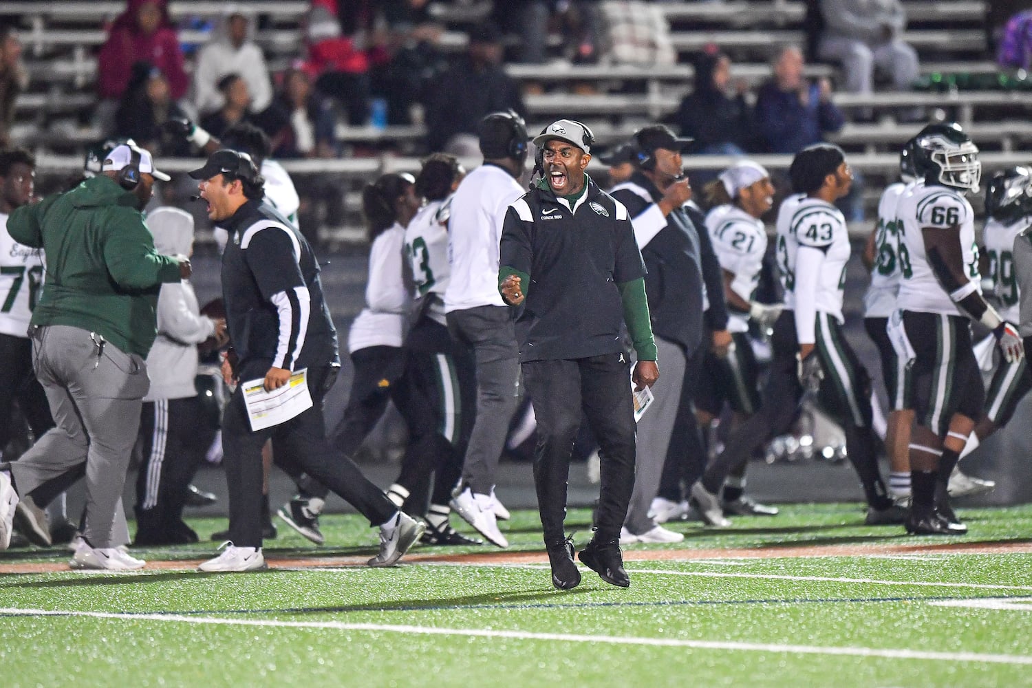 Collins Hill’s sidelines reacts to an Eagles touchdown against North Cobb during the first half of play Friday, Nov. 10, 2023 at North Cobb High School. (Daniel Varnado/For the AJC)