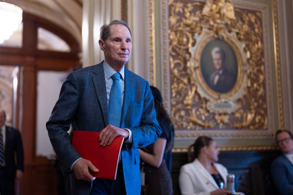 Sen. Ron Wyden, D-Ore., arrives as Senate Democrats gather behind closed doors to mount a last-ditch protest over a Republican-led spending bill that already passed the House, at the Capitol in Washington, Thursday, March 13, 2025. (AP Photo/J. Scott Applewhite)