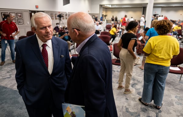 Gwinnett County Board of Education Superintendent J. Alvin Wilbanks, left, talks with Marshall Boutwell before a meeting of the board of education on June 17, 2021. Ben Gray for the Atlanta Journal-Constitution