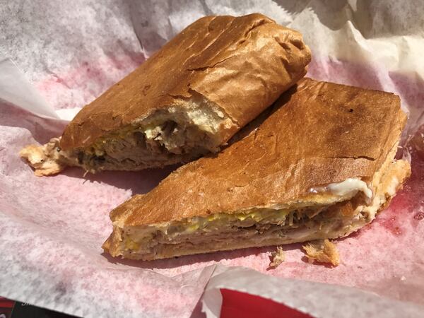 A Cuban sandwich from Mami’s La Cubana Restaurant in Hapeville. LIGAYA FIGUERAS / LFIGUERAS@AJC.COM