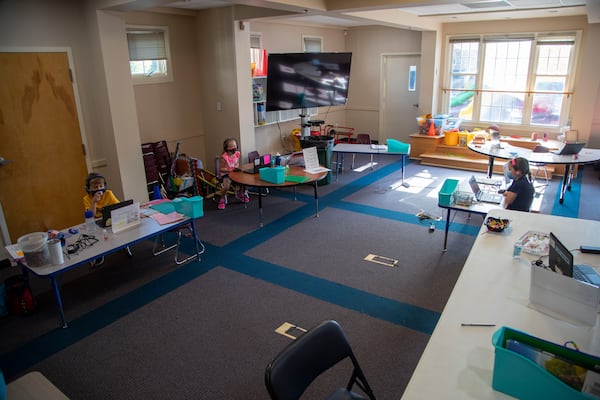 08/05/2020 - Marietta, Georgia - Students are socially distanced as they participate in virtual learning on their laptops at the Emily Lembeck Learning Center in Marietta, Wednesday, August 5, 2020. The learning center is part of the Marietta City Schools district. The Marietta City School System is offering childcare for staff while the district is operating on a virtual-only option. Each class will be staffed by MCS staff members, and no more than five children will be in each class to allow for social distancing. (ALYSSA POINTER / ALYSSA.POINTER@AJC.COM)