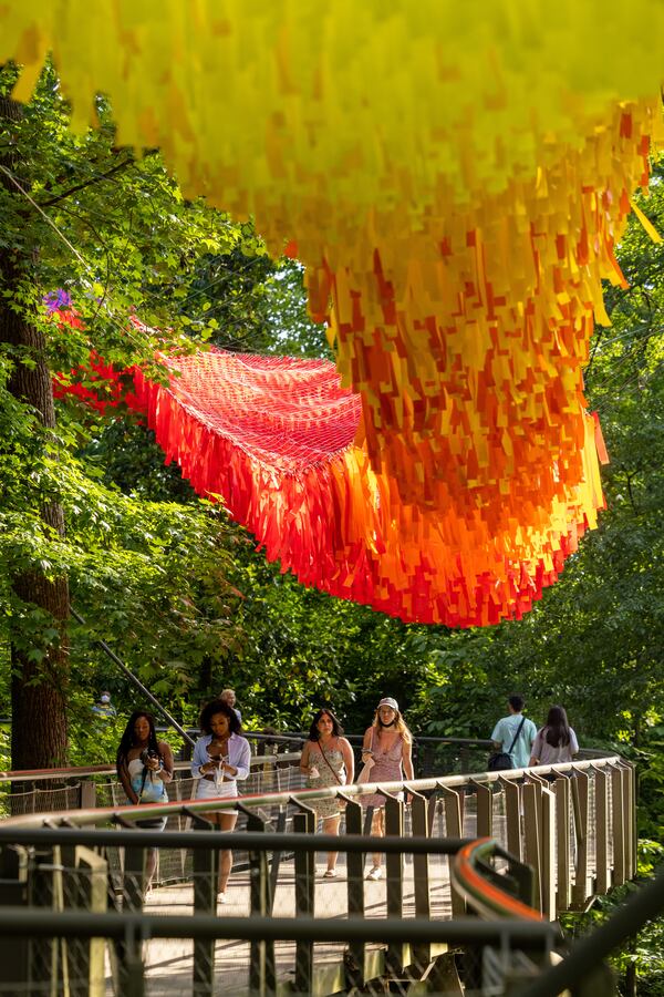 This colorful SkyNet installation is composed of thousands of nylon streamers attached to a flexible web of cords. It sways and flickers with the wind. Photos: Jason Getz/Atlanta Botanical Garden