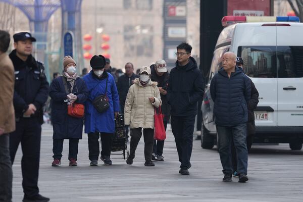 Family members of passengers who were on board the MH370 Malaysia Airline jet that went missing in 2014 leave after meeting Chinese Foreign Ministry officials in Beijing, China, Saturday, March 8, 2025. (AP Photo/Ng Han Guan)