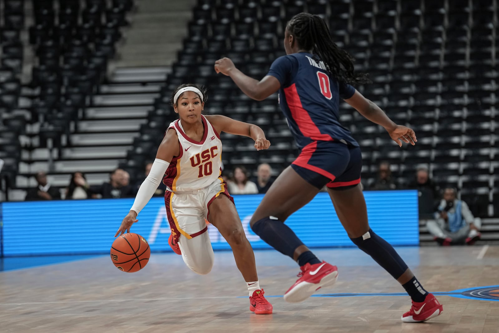 USC Trojans's guard Malia Samuels, left, competes for the ball against Ole Miss's guard Sira Thienou, left, during the basketball match between the University of Southern California (USC) and Ole Miss, Monday, Nov. 4, 2024 in Paris, France. (AP Photo/Aurelien Morissard)