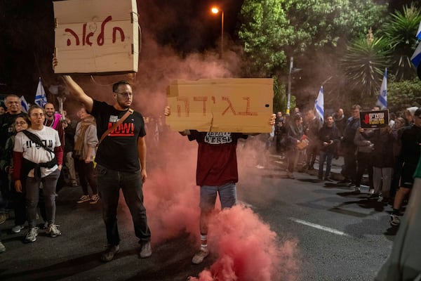 People protest against Prime Minister Benjamin Netanyahu near his residence in Jerusalem after he has dismissed his defense minister Yoav Gallant in a surprise announcement, Tuesday, Nov. 5, 2024. (AP Photo/Ohad Zwigenberg)