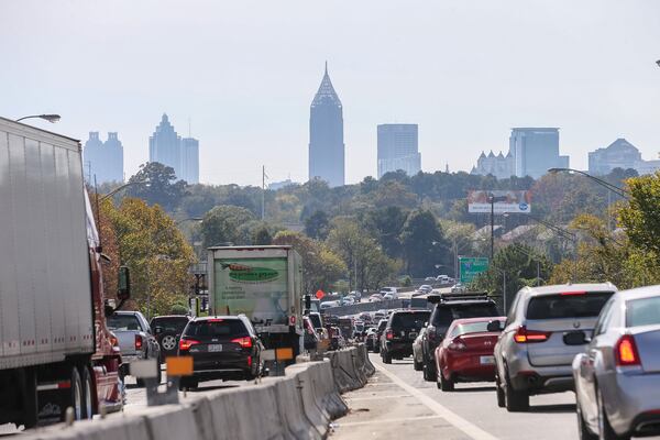 The Georgia Forestry Commission said smoke, which was visible Wednesday in Cobb, DeKalb and Fulton counties, is not the result of new, local wildfires. JOHN SPINK / JSPINK@AJC.COM