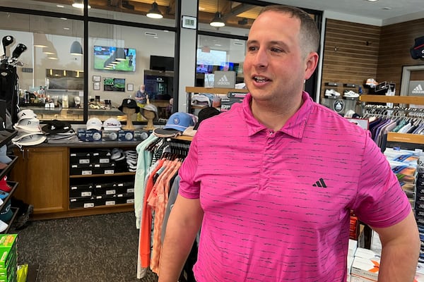 Stone Creek Golf Course manager Connor Farrell talks with some of the dozens of players who came out to the Omaha, Neb., club's pro shop on Monday, March 3, 2025, for the first day of the course's regular golf season hours. (AP Photo/Margery Beck)