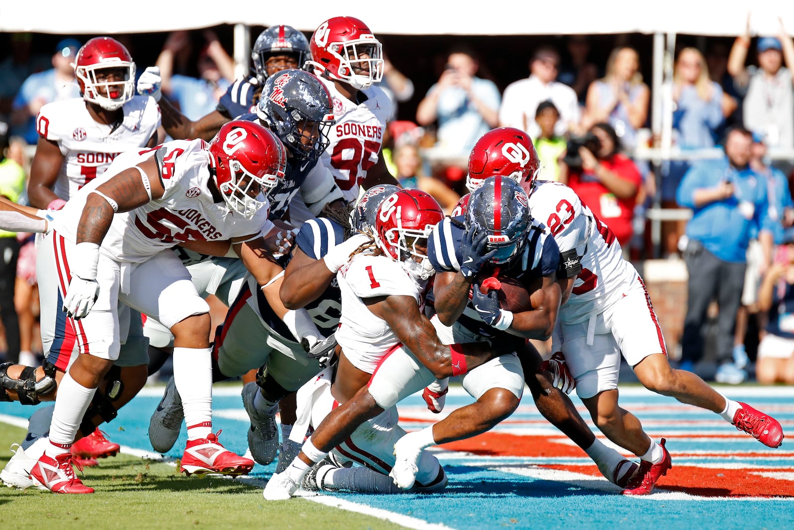 Mississippi running back Henry Parrish, Jr. (21) pushes over the goal line to score the first touchdown of the game during the first half of an NCAA college football game against Oklahoma, Saturday, Oct. 26, 2024, in Oxford, Miss. (AP Photo/Sarah Warnock)