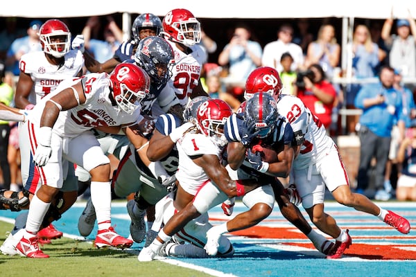 Mississippi running back Henry Parrish, Jr. (21) pushes over the goal line to score the first touchdown of the game during the first half of an NCAA college football game against Oklahoma, Saturday, Oct. 26, 2024, in Oxford, Miss. (AP Photo/Sarah Warnock)