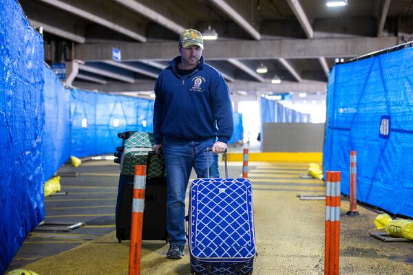 A person walks through construction in the North Parking Deck by Hartsfield-Jackson Domestic Terminal in Atlanta on Friday, February 3, 2023. (Arvin Temkar / arvin.temkar@ajc.com)