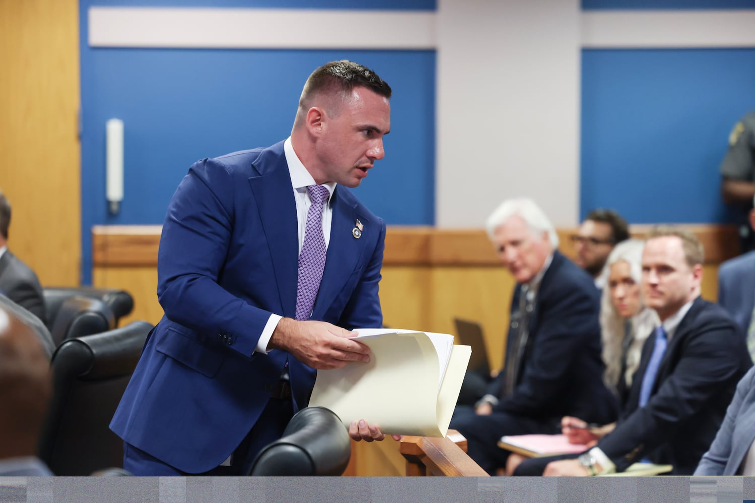 Deputy District Attorney Will Wooten prepares to argue before Fulton County Superior Judge Scott McAfee as he hears motions from attorneys representing Ken Chesebro and Sidney Powell in Atlanta on Wednesday, Sept. 6, 2023.  (Jason Getz / Jason.Getz@ajc.com)