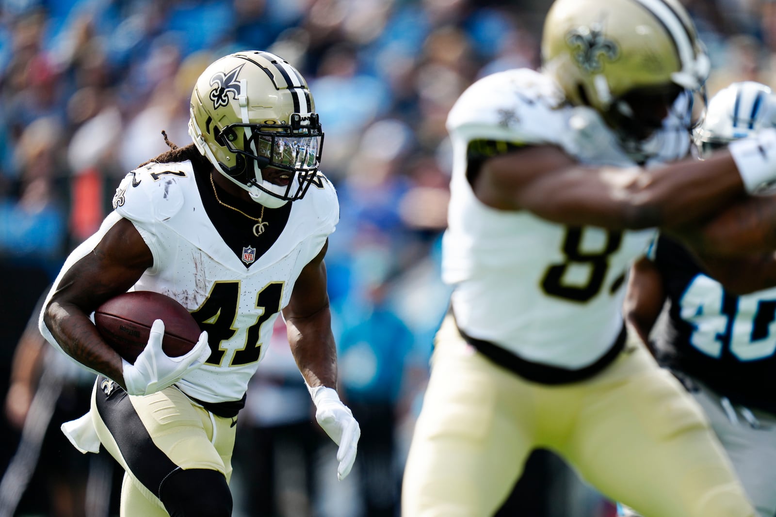 New Orleans Saints running back Alvin Kamara runs against the Carolina Panthers during the first half of an NFL football game Sunday, Nov. 3, 2024, in Charlotte, N.C. (AP Photo/Rusty Jones)