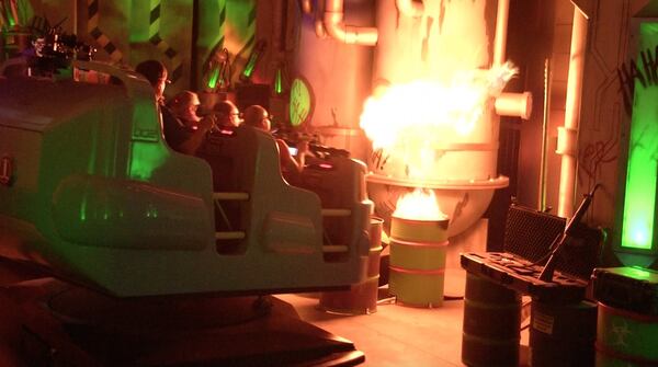 Riders encounter a fiery blast on the new Justice League: Battle for Metropolis ride at Six Flags Over Georgia. CONTRIBUTED BY SIX FLAGS OVER GEORGIA