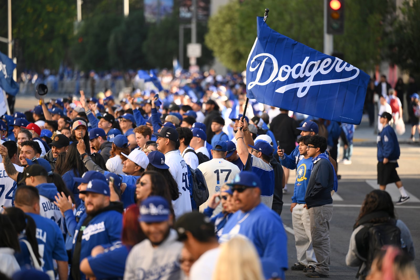 Fans crowd behind barricades waiting for the start of the Los Angeles Dodgers baseball World Series championship parade Friday, Nov. 1, 2024, in Los Angeles. (AP Photo/Kyusung Gong)