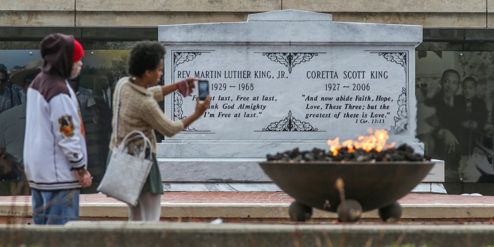 January 12, 2017 Atlanta: Alvin Sims (left) and Brandi Chapel (right) were part of a group from WOW In-Sync that visited the cryptÊof Dr. and Mrs. King, Eternal Flame, Freedom Walkway and Reflecting Pool Thursday, Jan. 12, 2017 at the King Center at 449 Auburn Ave NE, in Atlanta. Visitors to civil rights destination sites and programs in Atlanta are on the increase before the federal holiday. In Atlanta, the birthplace of the civil rights activist, there are numerous ways to acknowledge the upcoming federal holiday. Ebenezer Baptist Church, where King once served as co-pastor, will once again memorialize its most famous member during an annual celebration on Martin Luther King Jr. Day. The Martin Luther King Jr. commemorative service,  coming just days before Donald TrumpÕs inauguration, will feature Vermont Sen. Bernie Sanders, to deliver a Òspecial tributeÓ at MondayÕs Ebenezer Baptist Church ceremony.ÊElsewhere, Atlanta museums will host family-friendly educational programs, and counties throughout metro Atlanta will host local parades and programs. JOHN SPINK /JSPINK@AJC.COM