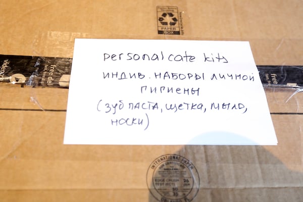 A box ready to be shipped shows what it contains in English and Ukrainian. Miguel Martinez for The Atlanta Journal-Constitution 