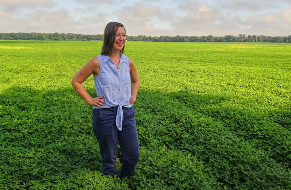 Farmer Casey Cox of Longleaf Ridge Farms stands in a peanut field on the property in Camilla. (Chris Hunt for The Atlanta Journal-Constitution)