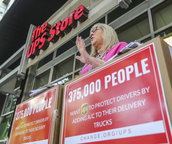 A petition announcement outside the UPS store in Midtown Atlanta. The petition asks UPS to add A/C to their trucks. JOHN SPINK/JSPINK@AJC.COM