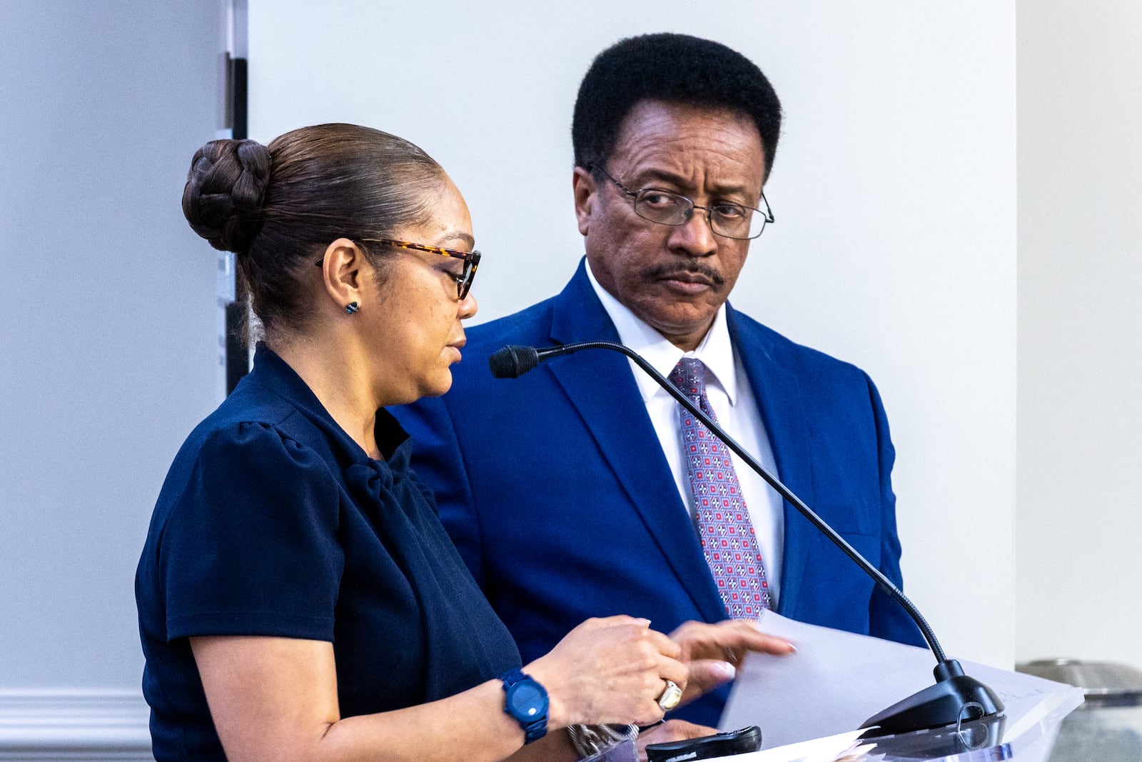 Deputy City Solicitor Erika Smith and City Solicitor Raines Carter speak at Atlanta City Council's Public Safety and Legal Administration Committee earlier this month. Smith has stated that her office can't pursue criminal charges against negligent apartment owners when on paper, a complex is owned by a limited liability company. (Arvin Temkar / Arvin.Temkar@ajc.com)