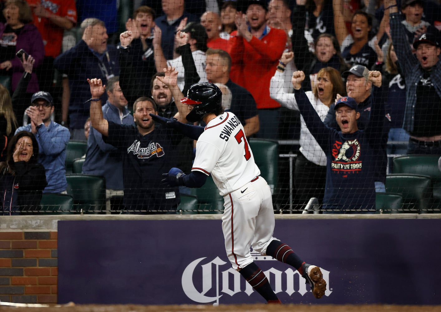 Atlanta Braves shortstop Dansby Swanson (7) scores against the Philadelphia Phillies on an RBI single by Austin Riley during the sixth inning of game two of the National League Division Series at Truist Park in Atlanta on Wednesday, October 12, 2022. (Jason Getz / Jason.Getz@ajc.com)