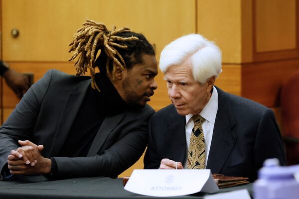 Shannon Stillwell, left, speaks with attorney David Botts on Monday, Feb. 13, 2023. 
Miguel Martinez / miguel.martinezjimenez@ajc.com