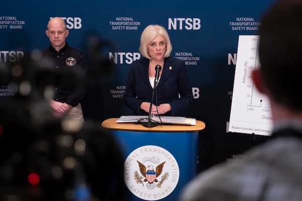 National Transportation Safety Board (NTSB) Chairwoman Jennifer Homendy, accompanied by investigator in charge Brice Banning, left, speaks about the recent mid-air collision of an American Airlines flight and a Black Hawk helicopter near Ronald Reagan Washington National Airport, at a news conference in Washington, Tuesday, March 11, 2025. (AP Photo/Ben Curtis)