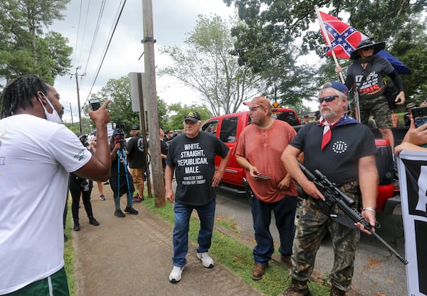 8/15/20 - Stone Mountain, GA - Counter protesters face off with protesters as several far-right groups, including militias and white supremacists, rally Saturday in the town of Stone Mountain, and a broad coalition of leftist anti-racist groups organized a counter-demonstration there after local authorities closed Stone Mountain park.   Jenni Girtman for the Atlanta Journal Constitution