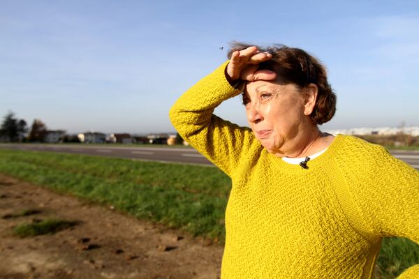 Shirley Sessions, the widow of WWII veteran Eddie Sessions, looks towards open farm land near the town of Coincy, France. In this same area, her husband spent Thanksgiving here 70 years ago during World War II. RYON HORNE/RHORNE@AJC.COM