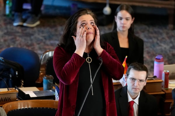 Rep. Aime Wichtendahl, D-Hiawatha, reacts as she speaks during debate on the gender identity bill, Thursday, Feb. 27, 2025, at the Statehouse in Des Moines, Iowa. (AP Photo/Charlie Neibergall)