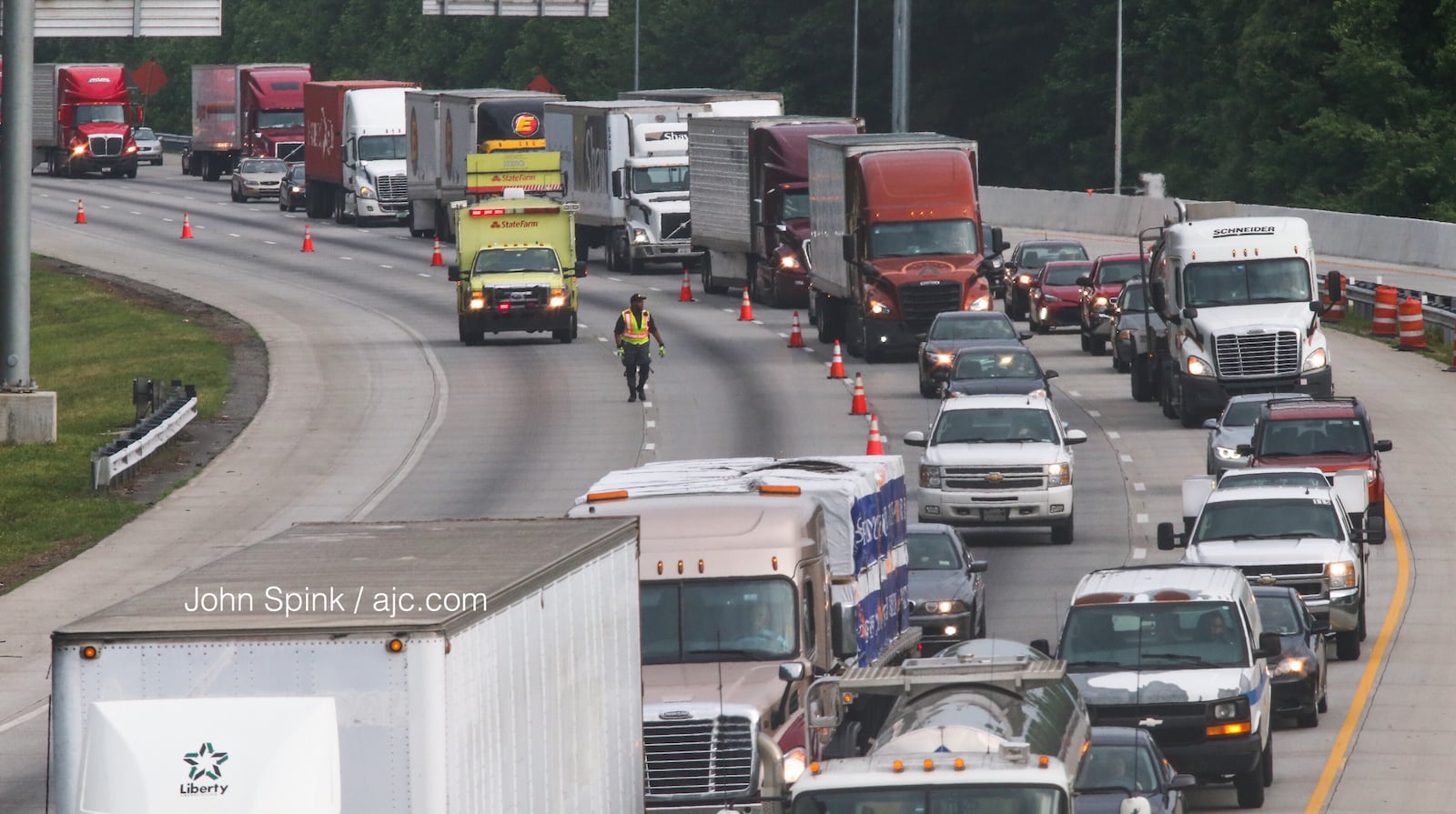 Traffic on I-75 South at Ga. 92 is moving again after a tractor-trailer hauling 19 cows overturned Thursday morning. Traffic was delayed for several hours beginning at 5 a.m. JOHN SPINK / JSPINK@AJC.COM