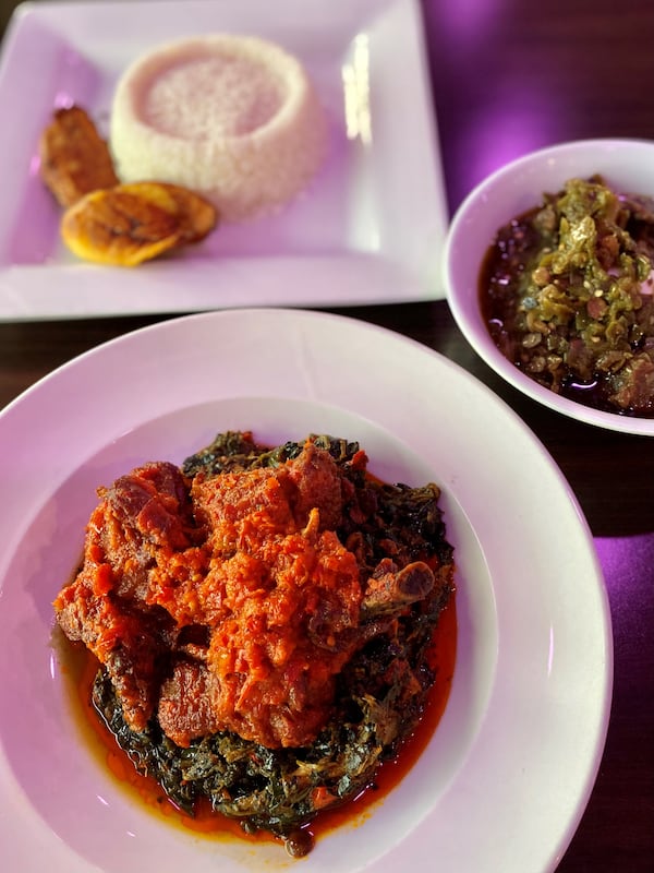 Among the Nigerian classics you can try at the Island Grill are ayamase stew (bottom) with plantains and rice; and efo riro, a thick green soup of amaranth greens, spicy pepper sauce and locust beans (right). Wendell Brock for The Atlanta Journal-Constitution