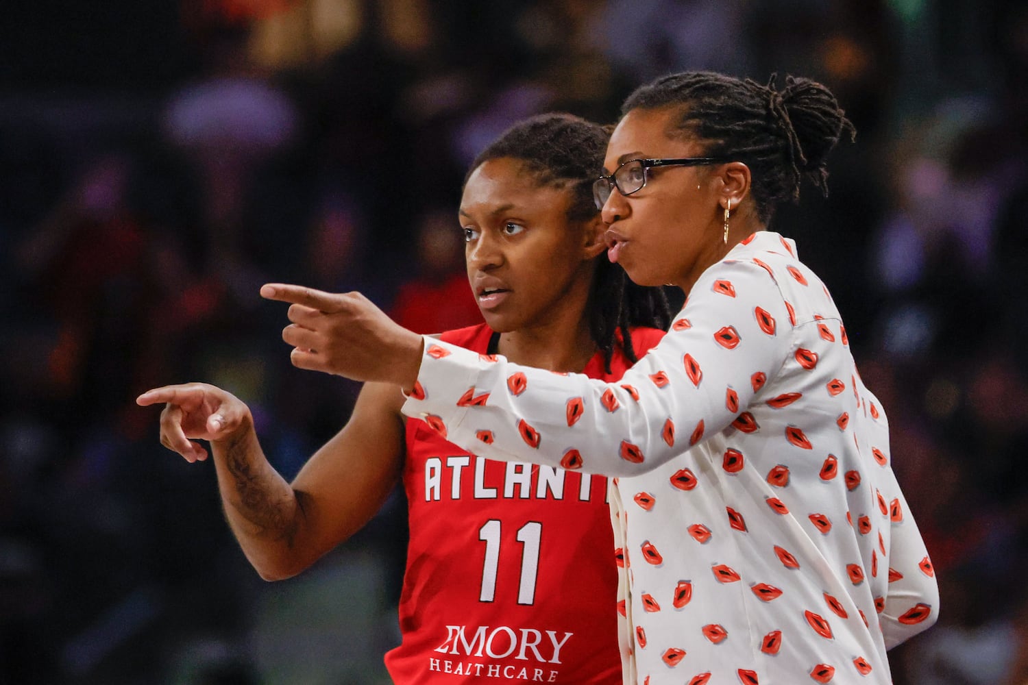 Atlanta Dream head coach Tanisha Wright gives directions to guard Crystal Dangerfield  during the first half at Gateway Center Arena, Sunday, May 26, 2024, in Atlanta.
(Miguel Martinez / AJC)