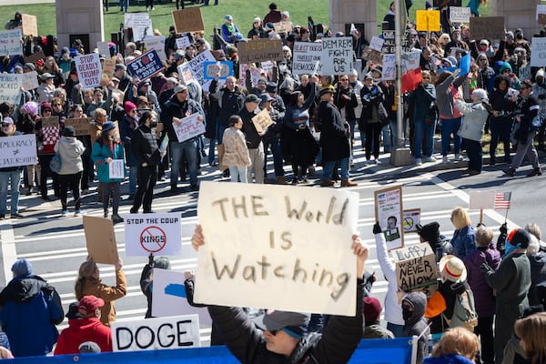 Protestors protest President Donald Trump and Elon Musk on Presidents Day in front of the Capitol in Atlanta on Monday, Feb. 17, 2025, as part of nationwide demonstrations organized by the 50501 movement. (Arvin Temkar / AJC)