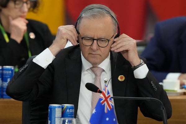 Australia's Prime Minister Anthony Albanese adjusts his headphones during the G20 Summit leaders meeting in Rio de Janeiro, Tuesday, Nov. 19, 2024. (AP Photo/Eraldo Peres)