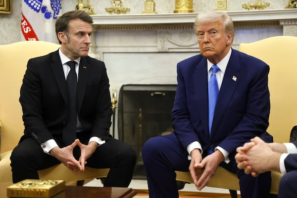 President Donald Trump, right, meets with France's President Emmanuel Macron in the Oval Office of the White House in Washington, Monday, Feb. 24, 2025. (Ludovic Marin/Pool via AP)