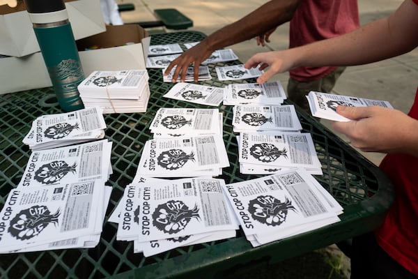 Activists gather in Gresham Park before speaking with nearby residents about the city's plans, which local groups have nicknamed "Cop City." Ben Gray for the Atlanta Journal-Constitution