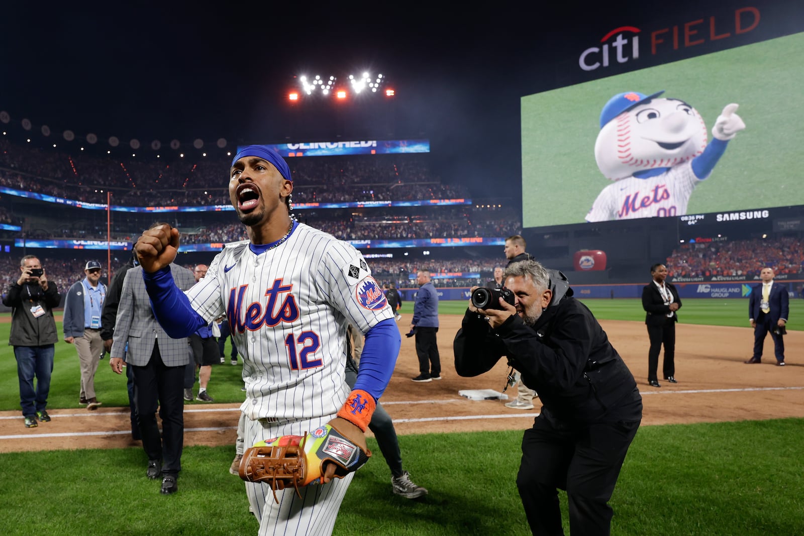 New York Mets shortstop Francisco Lindor (12) celebrates after the Mets beat the Philadelphia Phillies in Game 4 of the National League baseball playoff series, Wednesday, Oct. 9, 2024, in New York. (AP Photo/Adam Hunger)