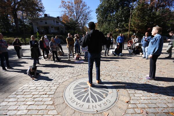 Atlanta City Councilwoman Carla Smith watches as mayoral candidate  Andre Dickens speak to a group of constituents at Grant Park on Saturday, November 20, 2021. Miguel Martinez for The Atlanta Journal-Constitution 