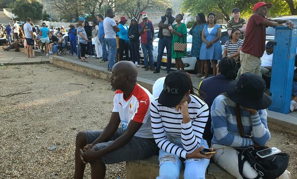 Namibians queue to cast their votes in a presidential election in Windhoek, Namibia Wednesday, Nov. 27, 2024. (AP Photo/Dirk Heinrich)