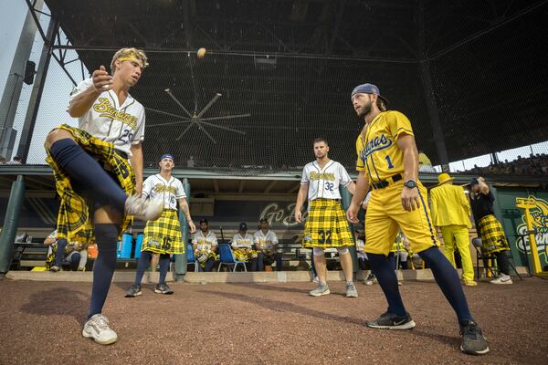 Savannah Bananas pitcher Josh Willitts, left, plays hackey sack with teammates during a rain delay prior to a game with the Holly Springs Salamanders at Historic Grayson Stadium. (AJC Photo/Stephen B. Morton)