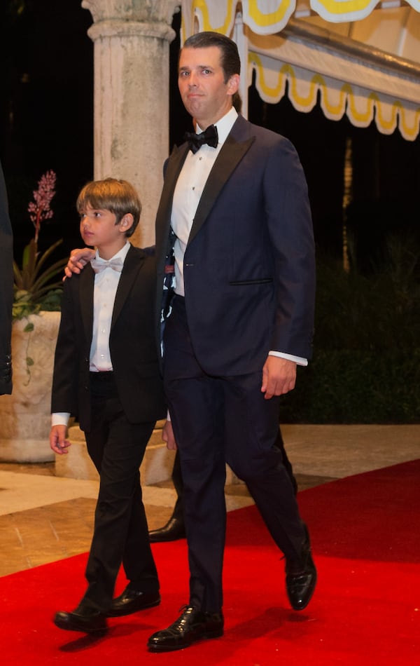 Donald Trump Jr. arrives for a New Year's Eve gala to join his father, President Donald Trump at the Mar-a-Lago club in Palm Beach, Fla., Dec. 31, 2017. (Greg Lovett / The Palm Beach Post)