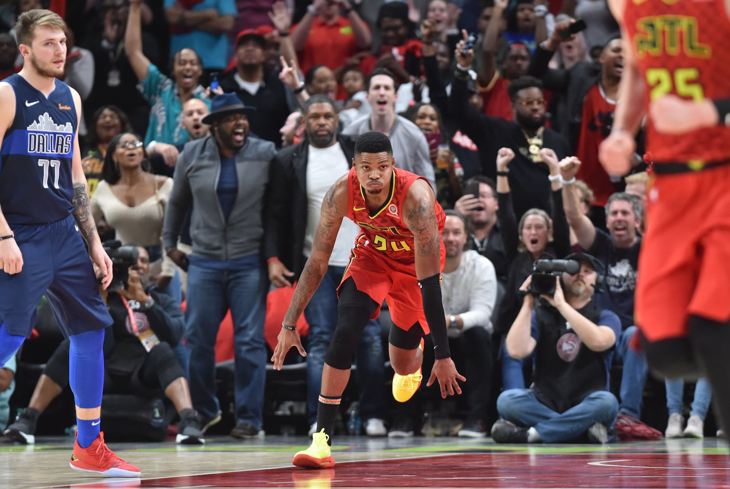 Photos: Hawks rally to beat Mavs in home opener