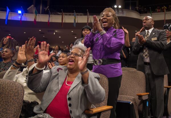 Marilyn Burnett (L) reacts to Jamal Bryant as he delivers his first sermon as the official pastor of New Birth Missionary Baptist Church in Stonecrest GA. Sunday, Dec. 9, 2018. Experts said that Bryant’s celebrity status could be an asset to the church, which needs to increase tithes and offerings to gain financial stability.  