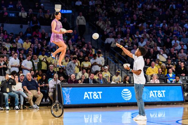 Georgia Tech quarterback TaQuon Marshall tosses bowls to Rong Niu, known as "Red Panda," during halftime of the Georgia Tech-Duke game Sunday at McCamish Pavilion.