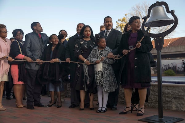 The extended King family prepares to ring a bell 39 times in remembrance of Martin Luther King Jr. at his crypt Wednesday evening in Atlanta. ALYSSA POINTER / ALYSSA.POINTER@AJC.COM