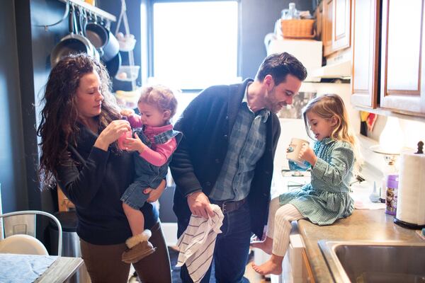 Stacy Williams, left, and her husband Zach Williams, lead singer of The Lone Bellow, with two of their children at their home in Brooklyn, New York. Stacy's chance to live a normal life seemed slim when she broke her neck in a horse riding accident in Georgia, but the experience and her recovery inspired Zach to began writing songs and pursue a career as a musician. (SPECIAL/BRANDEN CAMP)