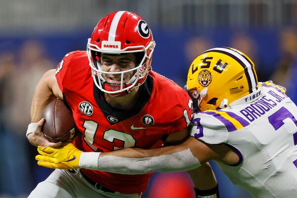 Georgia Bulldogs quarterback Stetson Bennett (13) runs against the LSU Tigers during the second half of the the SEC Championship game at Mercedes-Benz Stadium, Saturday, December 3, 2022, in Atlanta. (Jason Getz / Jason.Getz@ajc.com)
