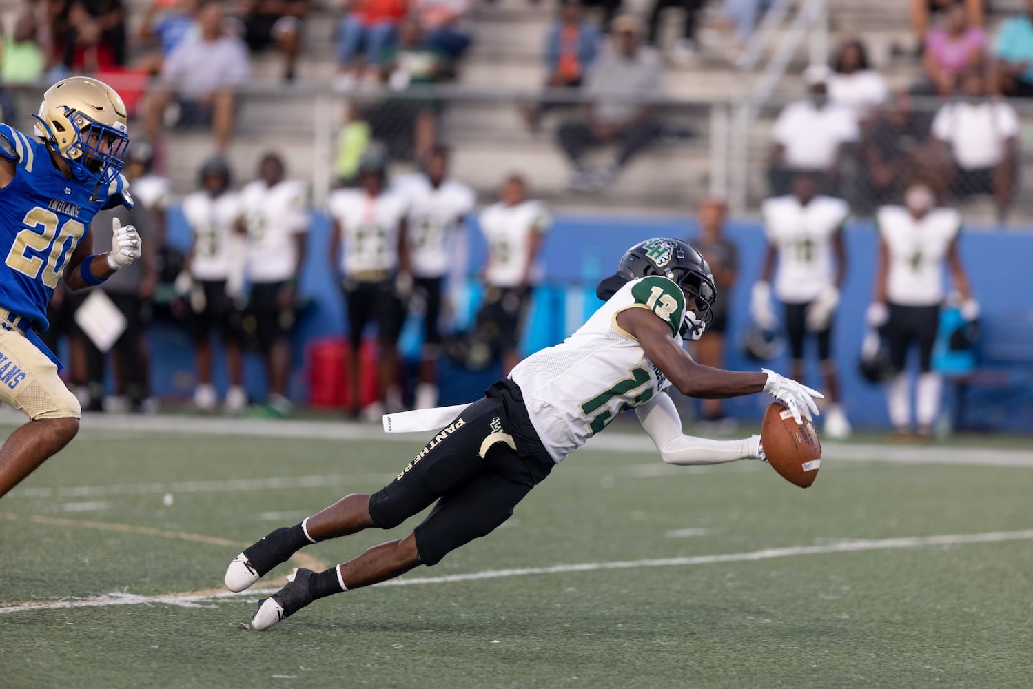 Langston Hughes's Jovanni McGee (13) reaches for a pass during a GHSA High School football game between Langston Hughes High School and McEachern High School at McEachern High School in Powder Springs, GA., on Friday, August 26, 2022. (Photo by Jenn Finch)