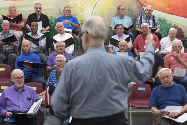 Members of the Georgia Festival Chorus watch Frank Boggs, the founding director, during rehearsals April 18 in Smyrna. DAVID BARNES / DAVID.BARNES@AJC.COM