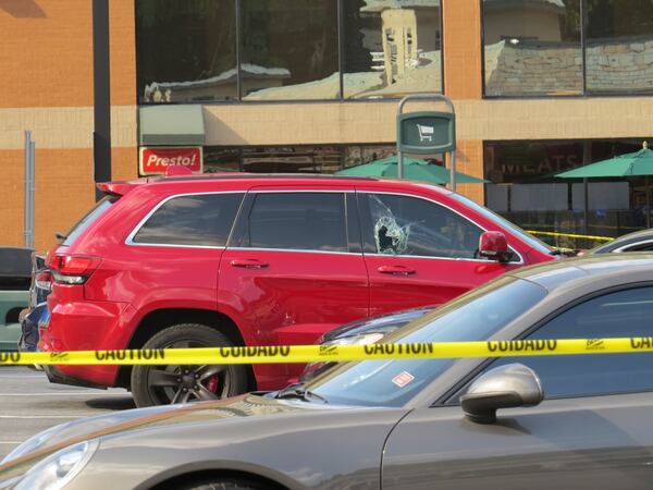 A bullet hole could be seen in the passenger window of the Jeep.